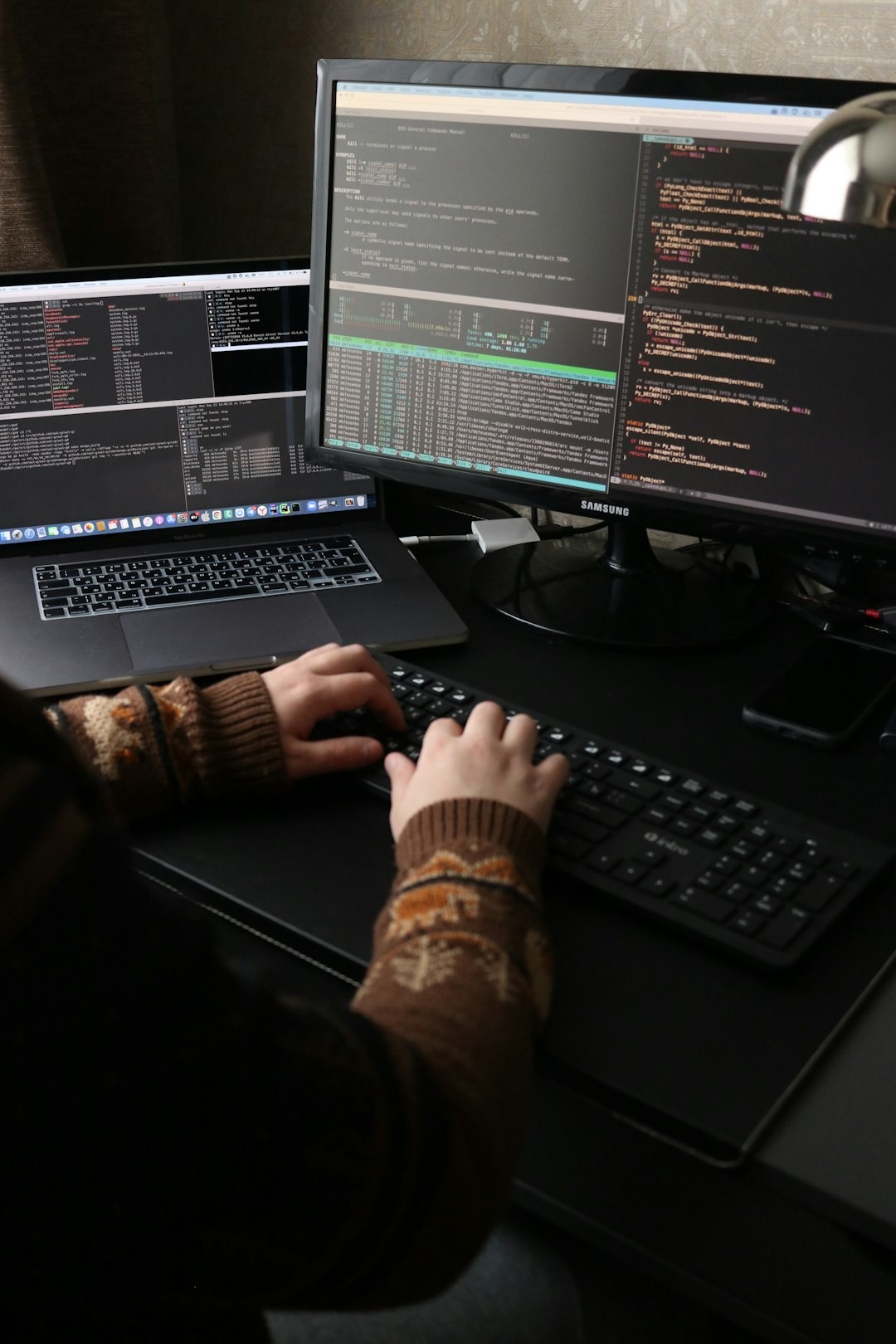 people sitting on chair in front of computer monitor